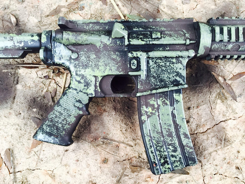 green camo paint on black rifle