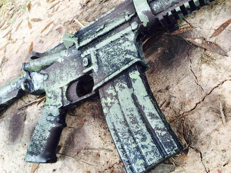 green camo paint on black rifle 2